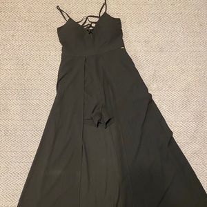 Black jumpsuit, short with long tail